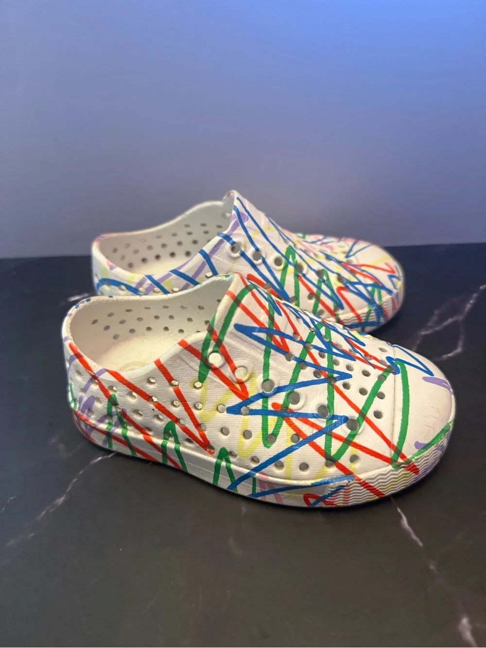 Native Kids White Slip-On Shoes with Crayola Multicolor Scribble Print